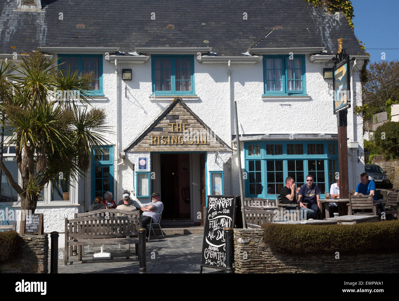 People sitting outside The Rising Sun pub, St Mawes, Cornwall, England, UK Stock Photo Alamy