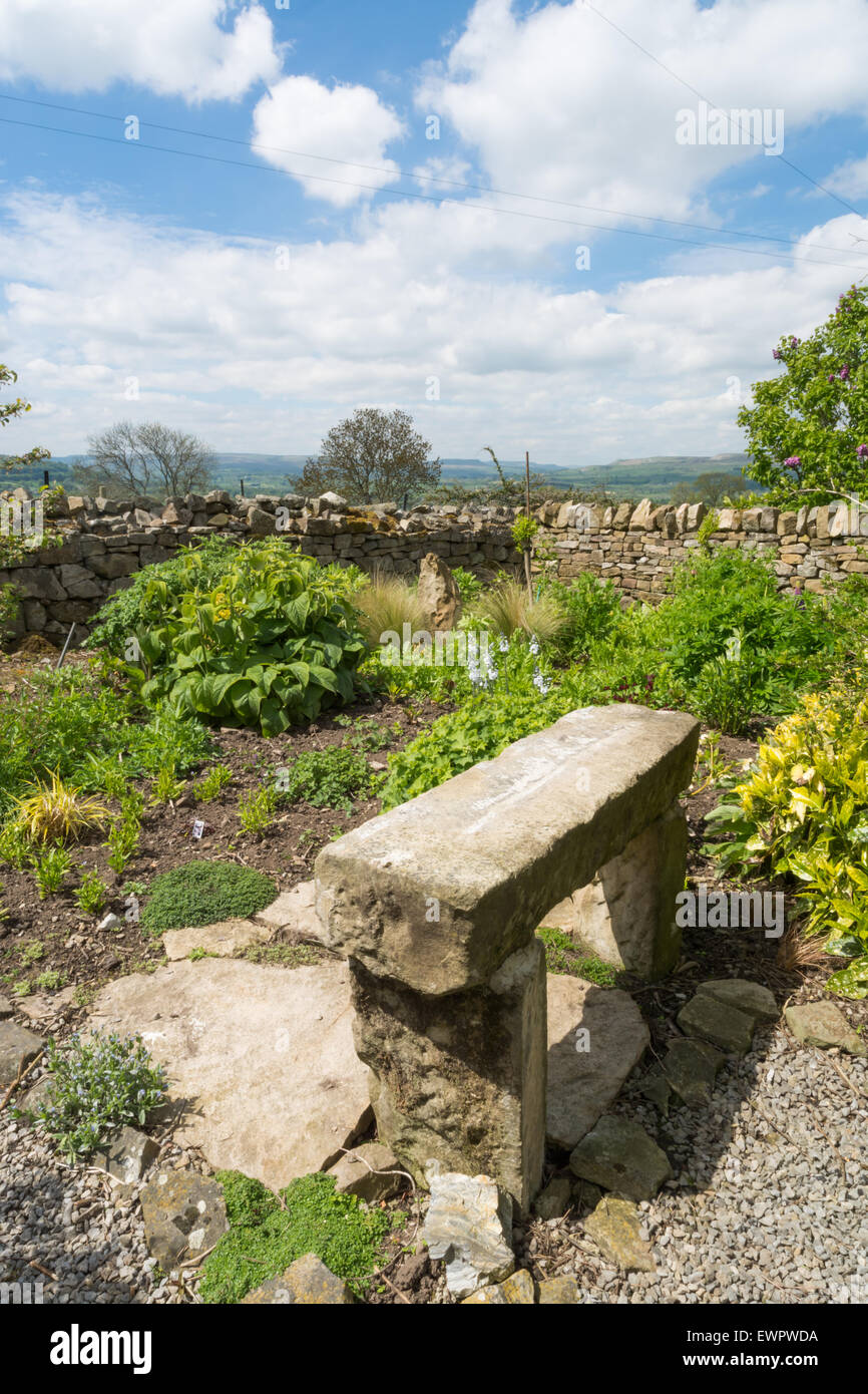 Stone Garden Seat In A Garden Stock Photo 84710790 Alamy