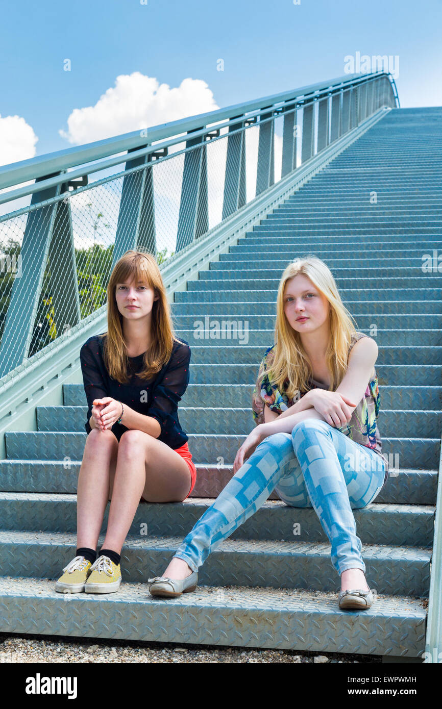 Two people sitting on stairs hi-res stock photography and images - Alamy