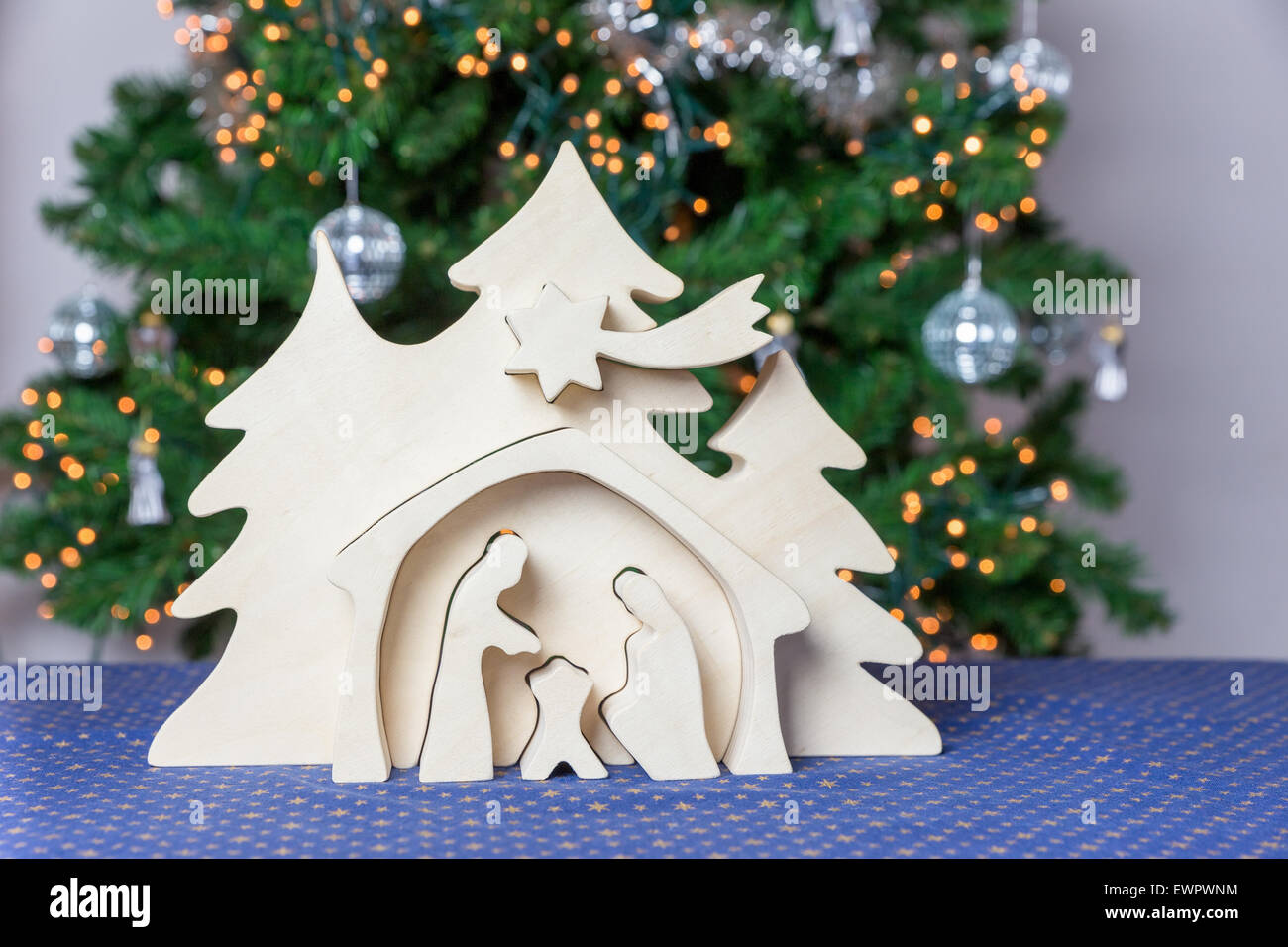 Blank wooden christmas crib with christmas tree as decoration Stock Photo
