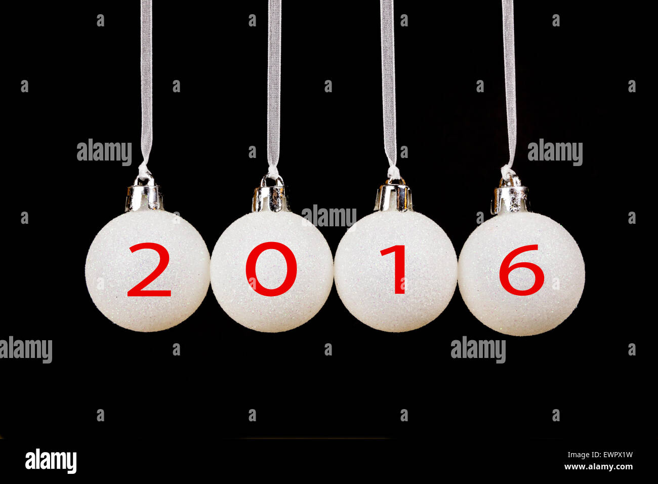 White christmas balls or baubles on black background with new year 2016 Stock Photo