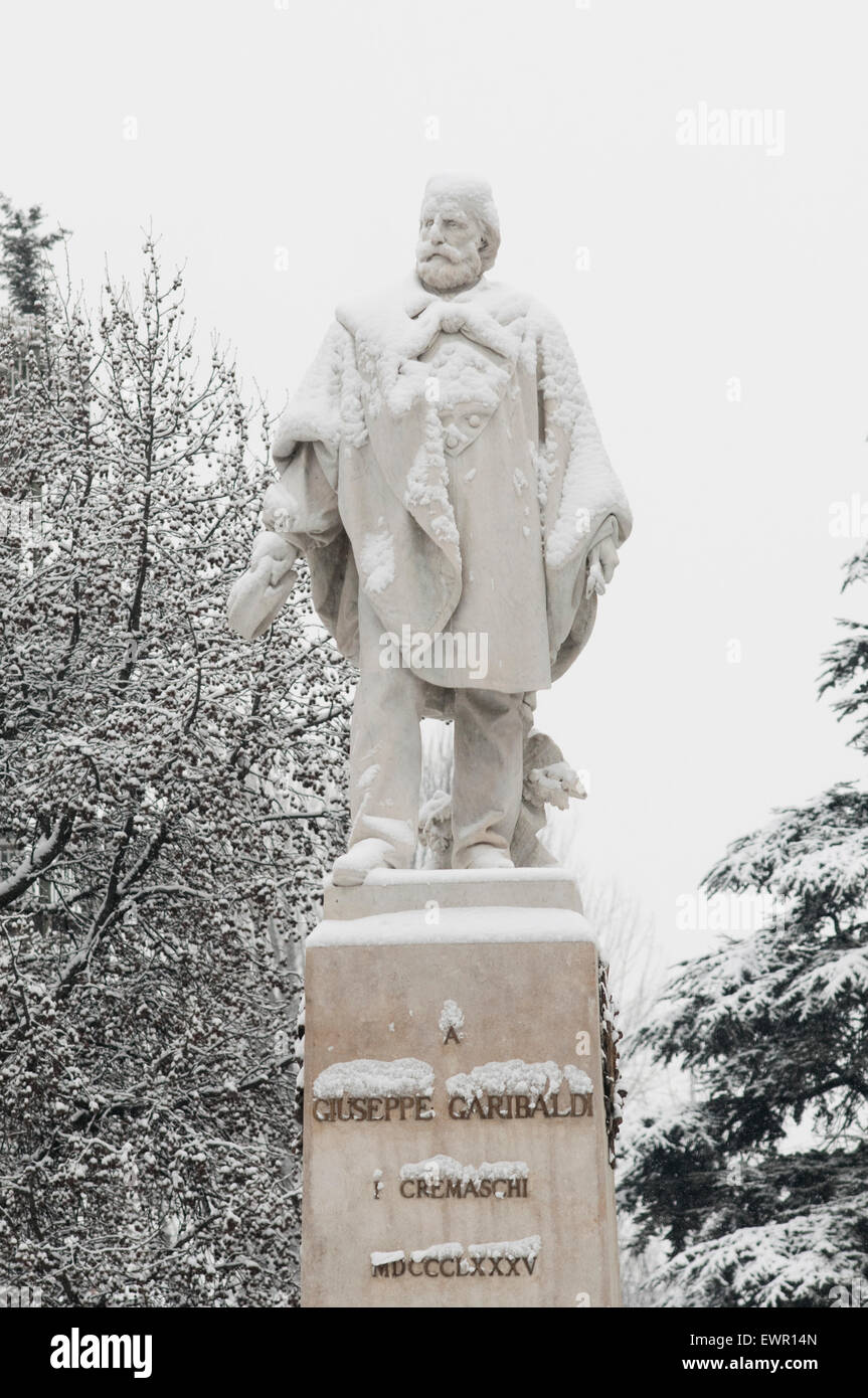 Italy, Lombardy, Crema, Piazza Giuseppe Garibaldi Square, Garibaldi Statue by Francesco Barzaghi Covered with Snow. Stock Photo
