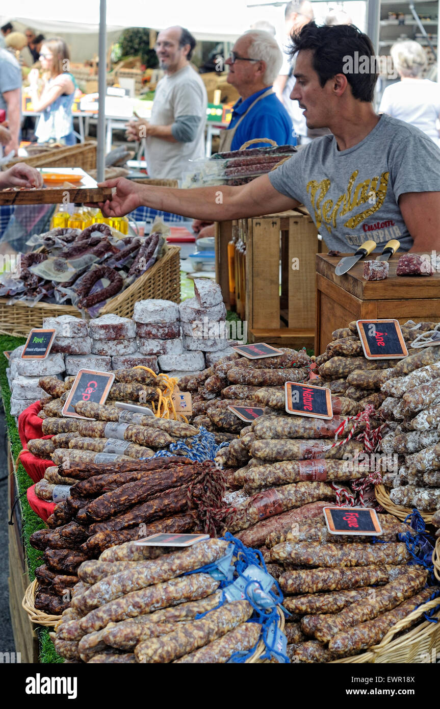Stand selling different classes of sausage at a local market in Ciboure (Ziburu), France. Stock Photo