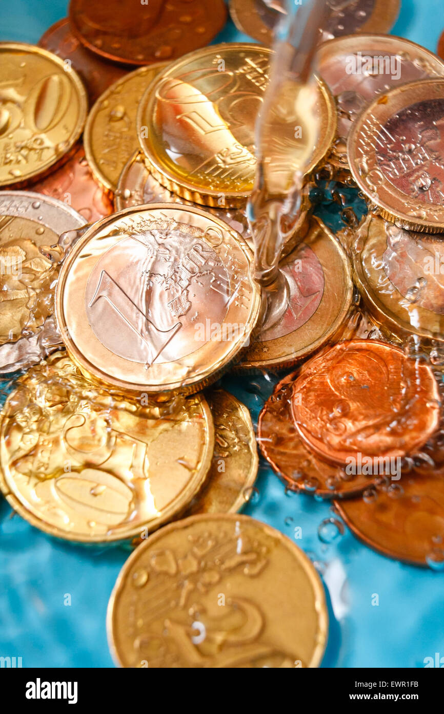 Water price concept with euro currency coins and water drops, vertical