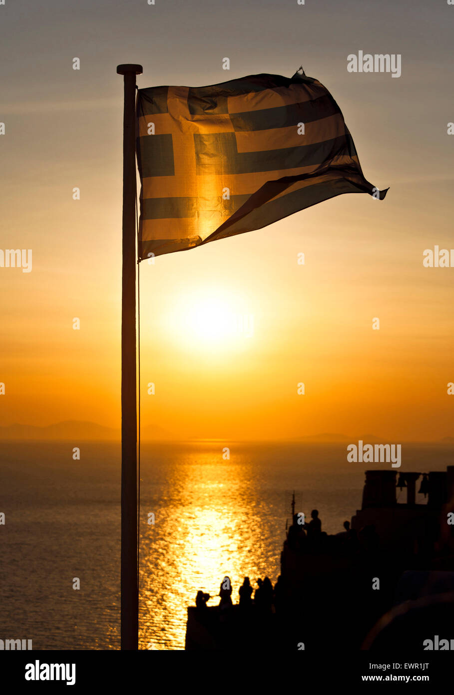 greek flag at sunset in santorini Stock Photo