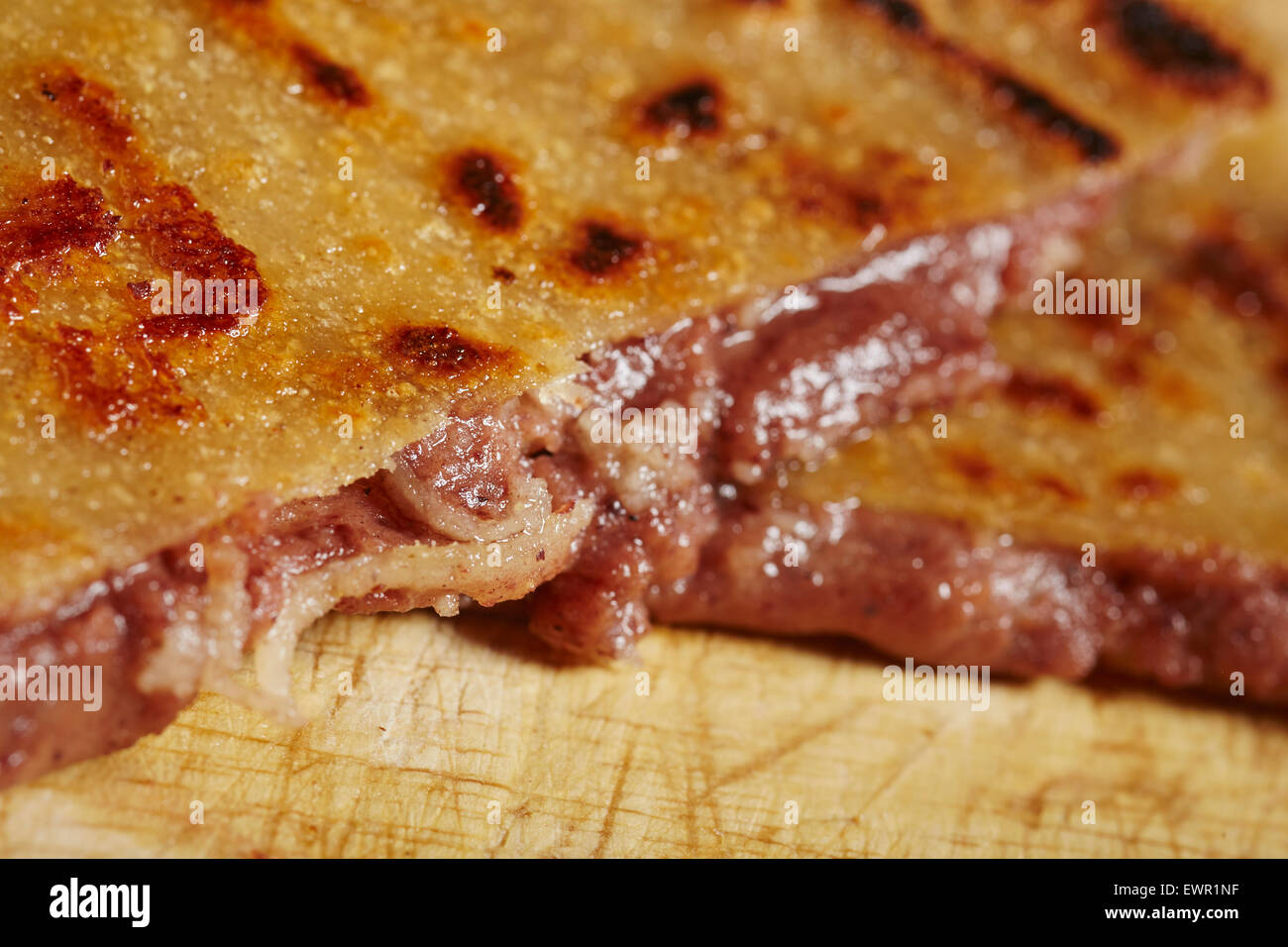 red bean and cheese pupusa, a typical street food from Honduras and El Salvador Stock Photo