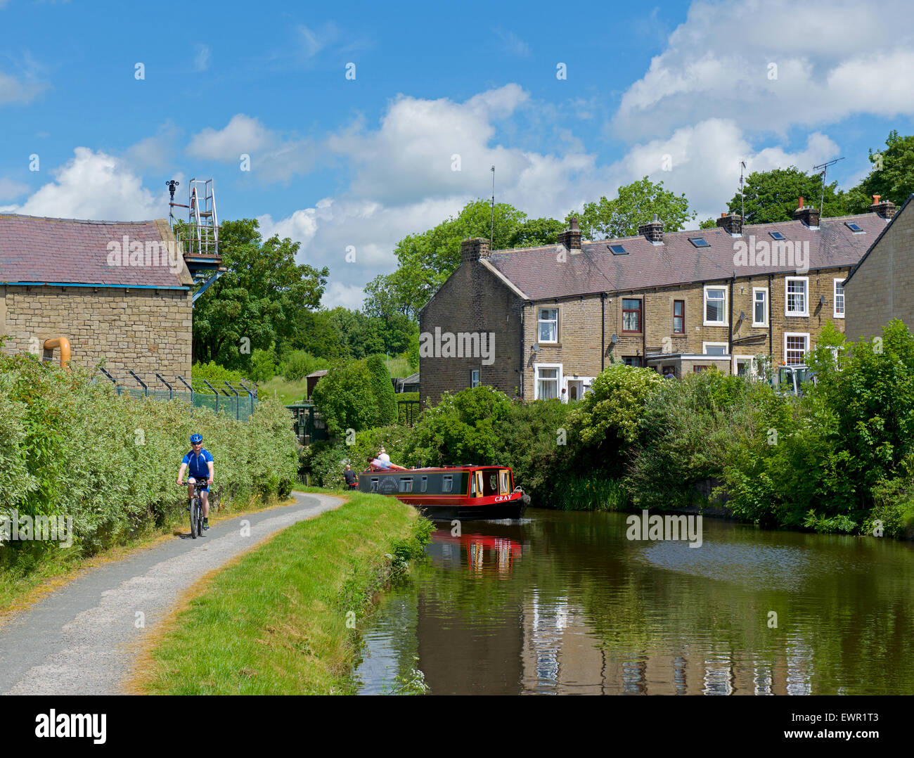 Narrowboat and cyclist on the towpath of the Leeds and Liverpool Canal