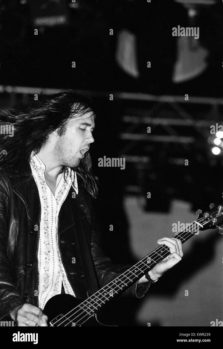 Krist Novoselic, bass guitarist of Seattle-based grunge rock group Nirvana,  on stage during the group's headlining performance at the Reading Festival. 30th August 1992. Stock Photo