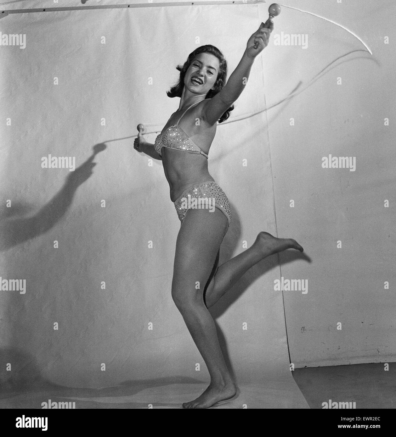 18 year old Eleanor Gunter, using a skipping rope, is an equilibrist, an acrobat who performs balancing feats. She's in the UK to appear at the Glasgow Empire theatre, 1st September 1957. Stock Photo