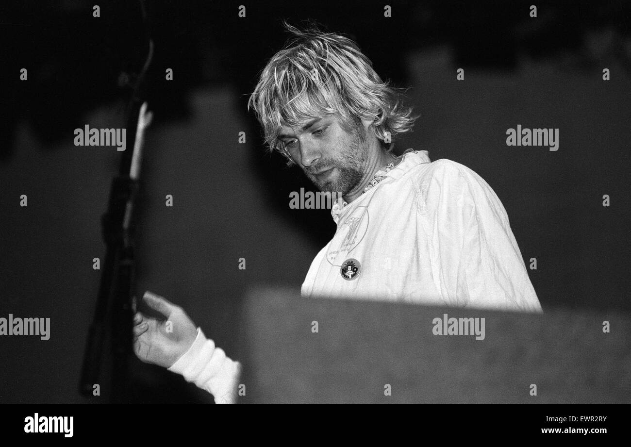 Kurt Cobain, lead singer of Seattle-based grunge rock group Nirvana, plays guitar on stage during the group's headlining performance at the Reading Festival. 30th August 1992. Stock Photo