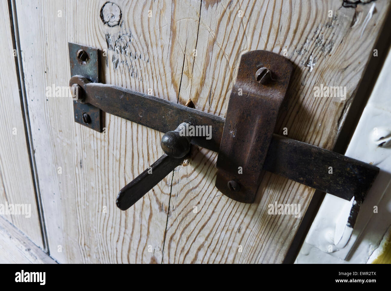 Metal latch on a wooden door. Stock Photo