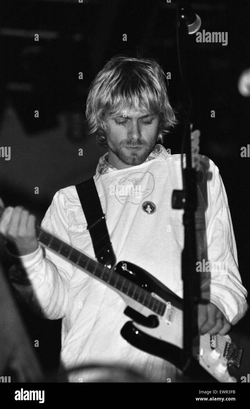 Kurt Cobain, lead singer of Seattle-based grunge rock group Nirvana, plays guitar on stage during the group's headlining performance at the Reading Festival. 30th August 1992. Stock Photo