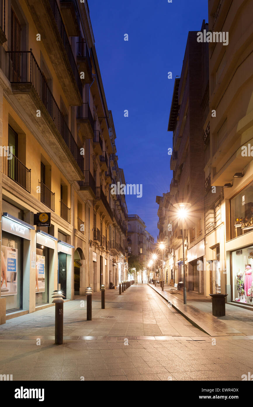 Street in the old town of Girona illuminated at night. Girona, Catalonia, Spain Stock Photo
