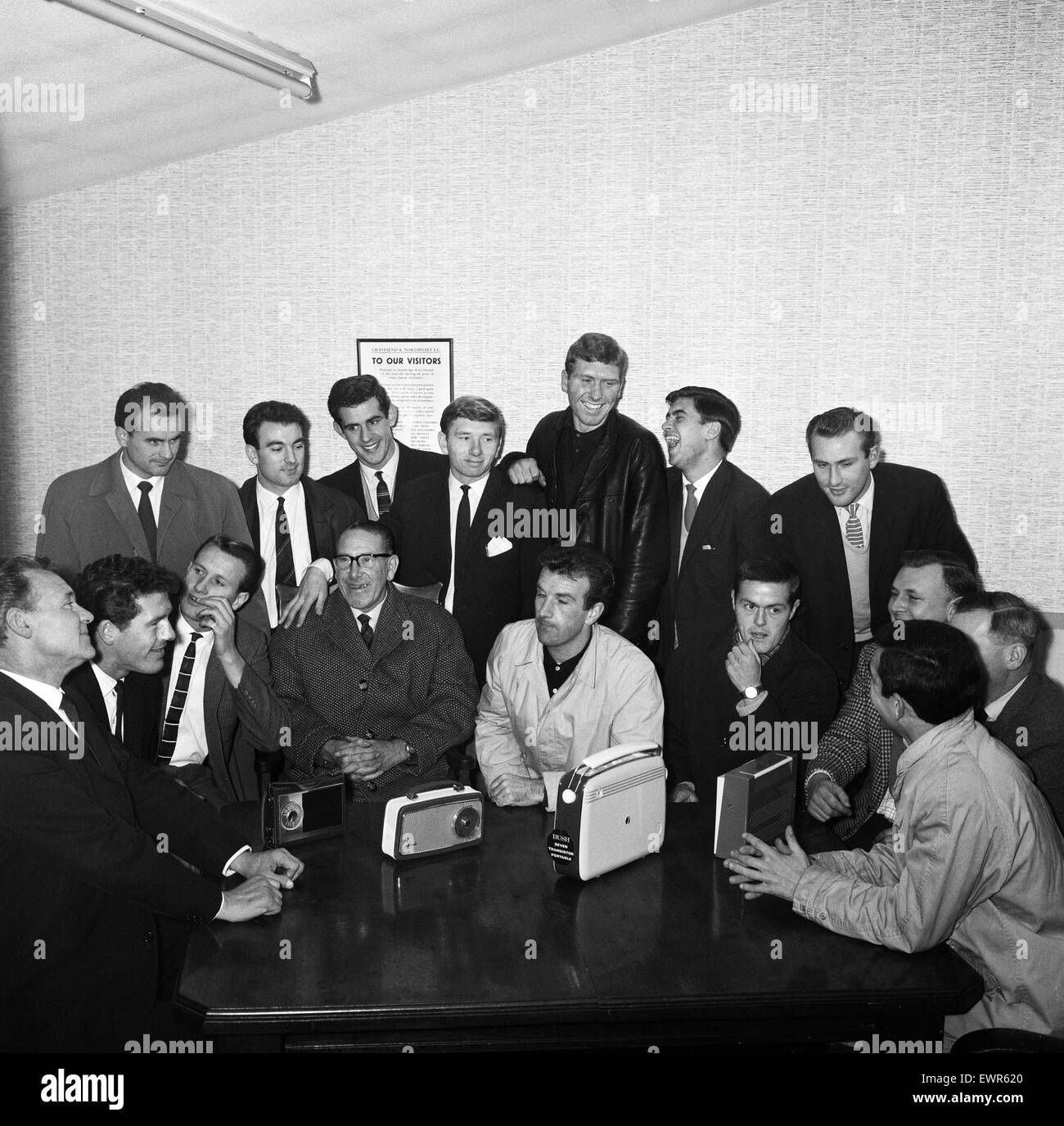 Footballer players of non league  Gravesend and  Northfleet listen to the draw for the FA Cup third round. They were drawn away at Carlisle United. 26th November 1962. Stock Photo