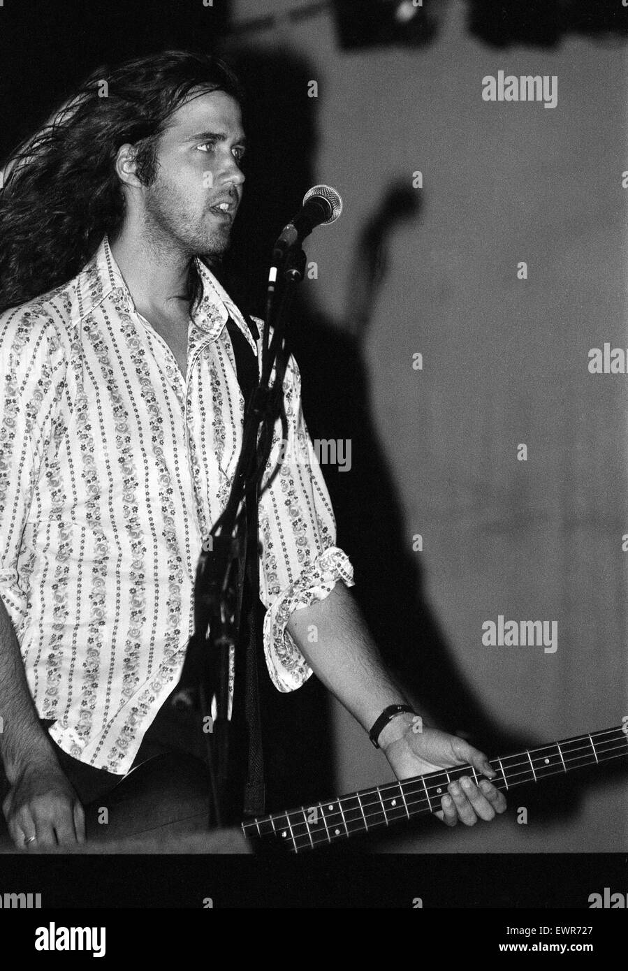 Krist Novoselic, bass guitarist of Seattle-based grunge rock group Nirvana,  on stage during the group's headlining performance at the Reading Festival. 30th August 1992. Stock Photo