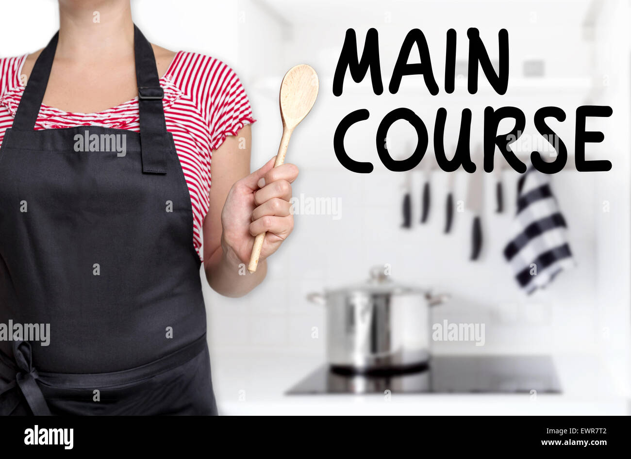 Main course cook holding wooden spoon background. Stock Photo