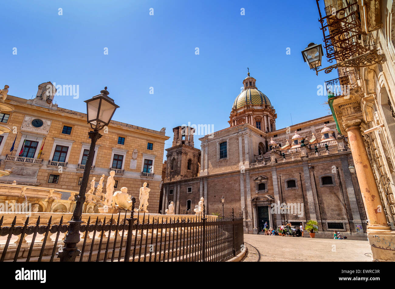 PALERMO, ITALY - AUGUST 16, 2014: tourists visit Piazza Pretoria, one of the loveliest squares in Palermo, Italy. Stock Photo