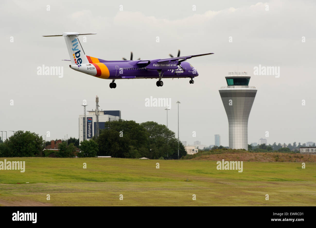 Flybe Dash 8 aircraft landing at Birmingham Airport, UK Stock Photo