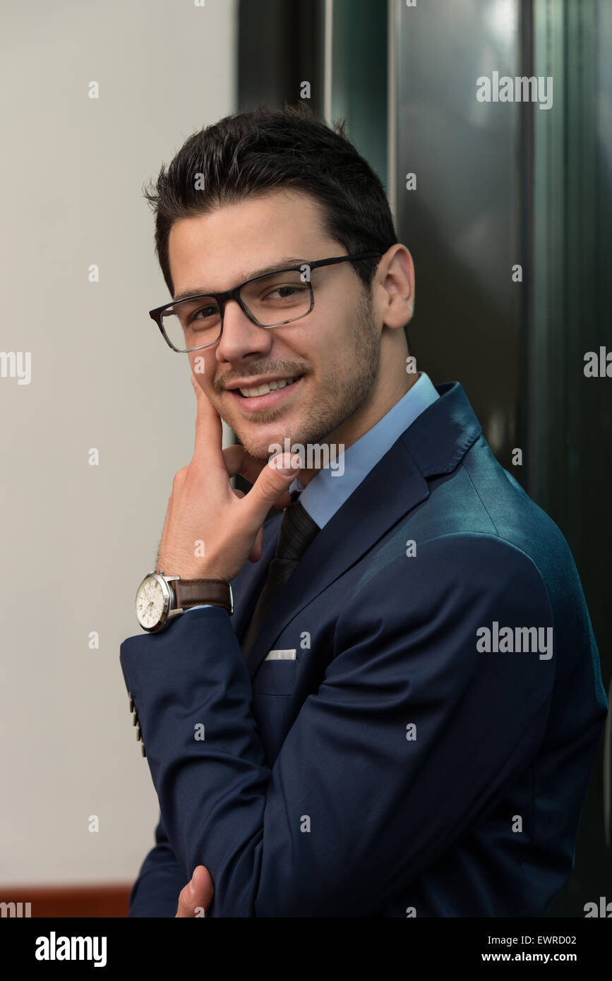 Portrait Of Handsome Confident Young Businessman Standing Arms Crossed ...