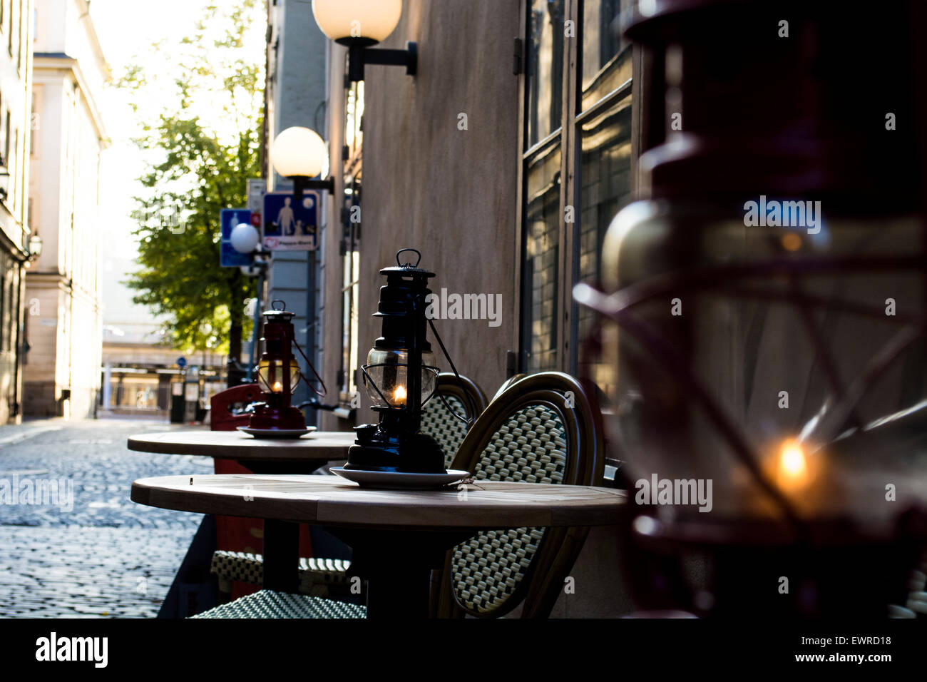 Lit oil lanterns candles on tables outside stylish café restaurant in Gamla  Stan (Old Town) Stockholm, Sweeden Stock Photo - Alamy