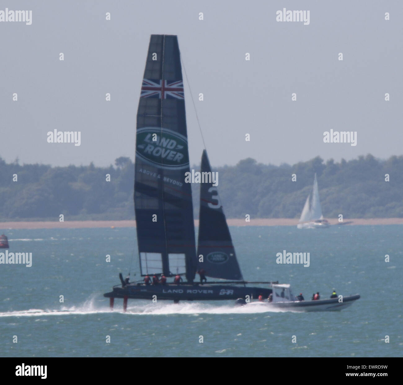 Lee on the Solent, Hampshire, UK. 30th June, 2015. Sir Ben Ainslie didn’t let the baking sunshine stop him from getting out on the water with his new Boat and racing team this morning.   The competitive challenger is out  training for the 35th America’s Cup. Sir Ben aims to win the oldest trophy in sport and bring the Cup back to Britain where it all began over 160 years ago. The Sportsman and his crew of ten spent the morning racing in the Solent watched by many people trying to keep cool on the beach.    Credit:  uknip/ Alamy Live News Stock Photo