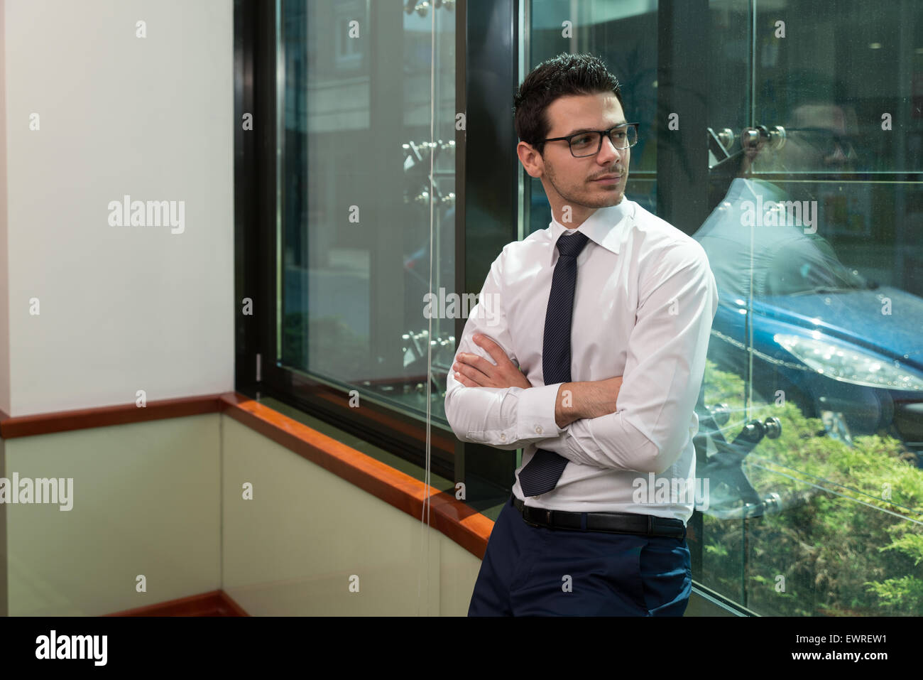 Portrait Of Handsome Confident Young Businessman Standing Arms Crossed ...