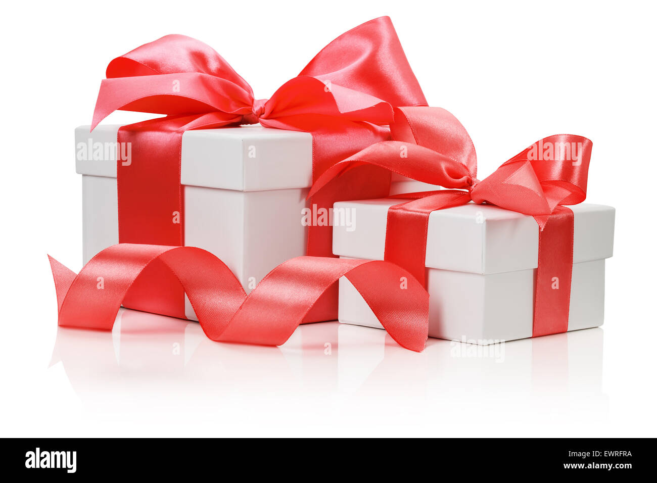 Two white boxes tied red ribbon bow isolated on the white background. Stock Photo