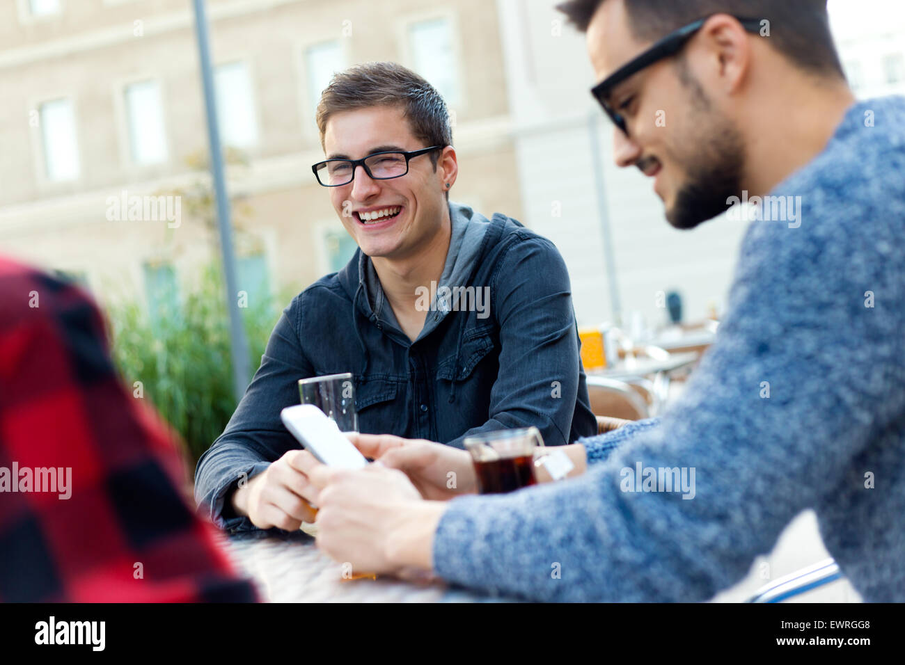 Outdoor portrait of young entrepreneurs working at coffee bar. Stock Photo