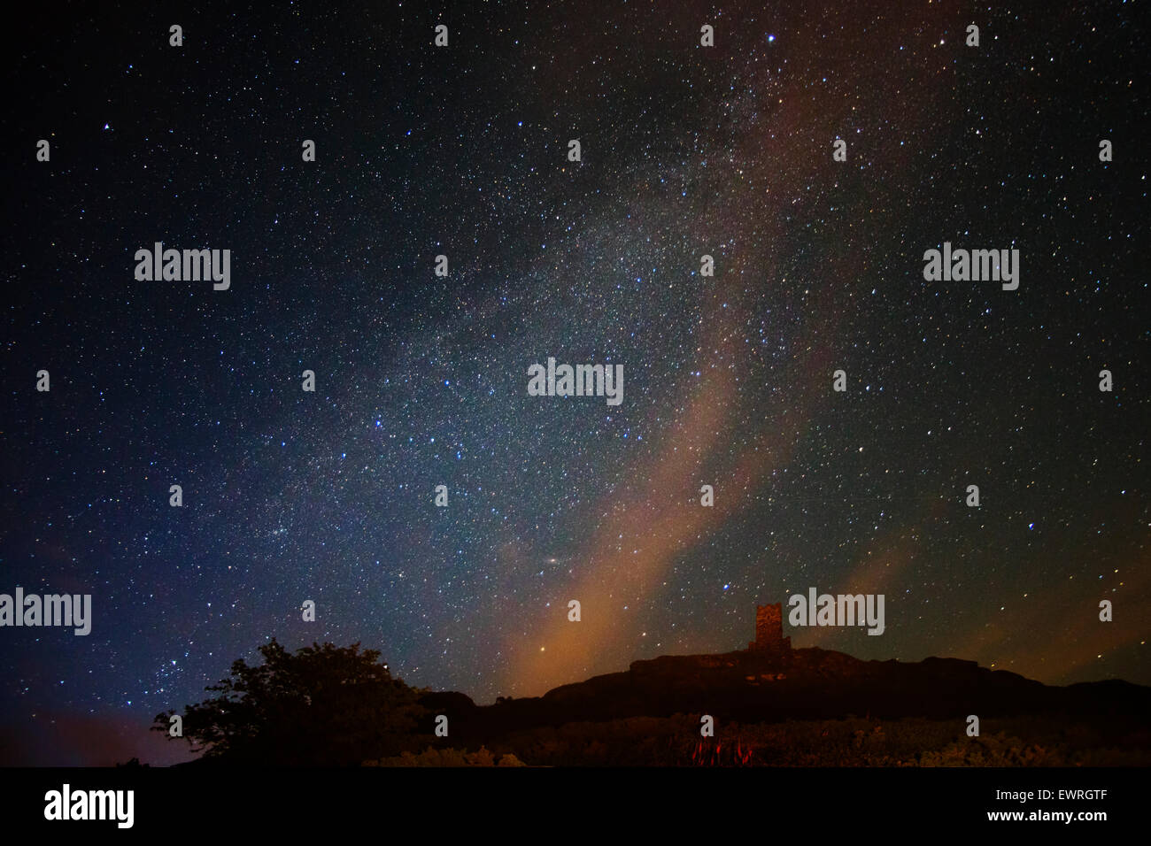 The milky way over Brentor church Stock Photo
