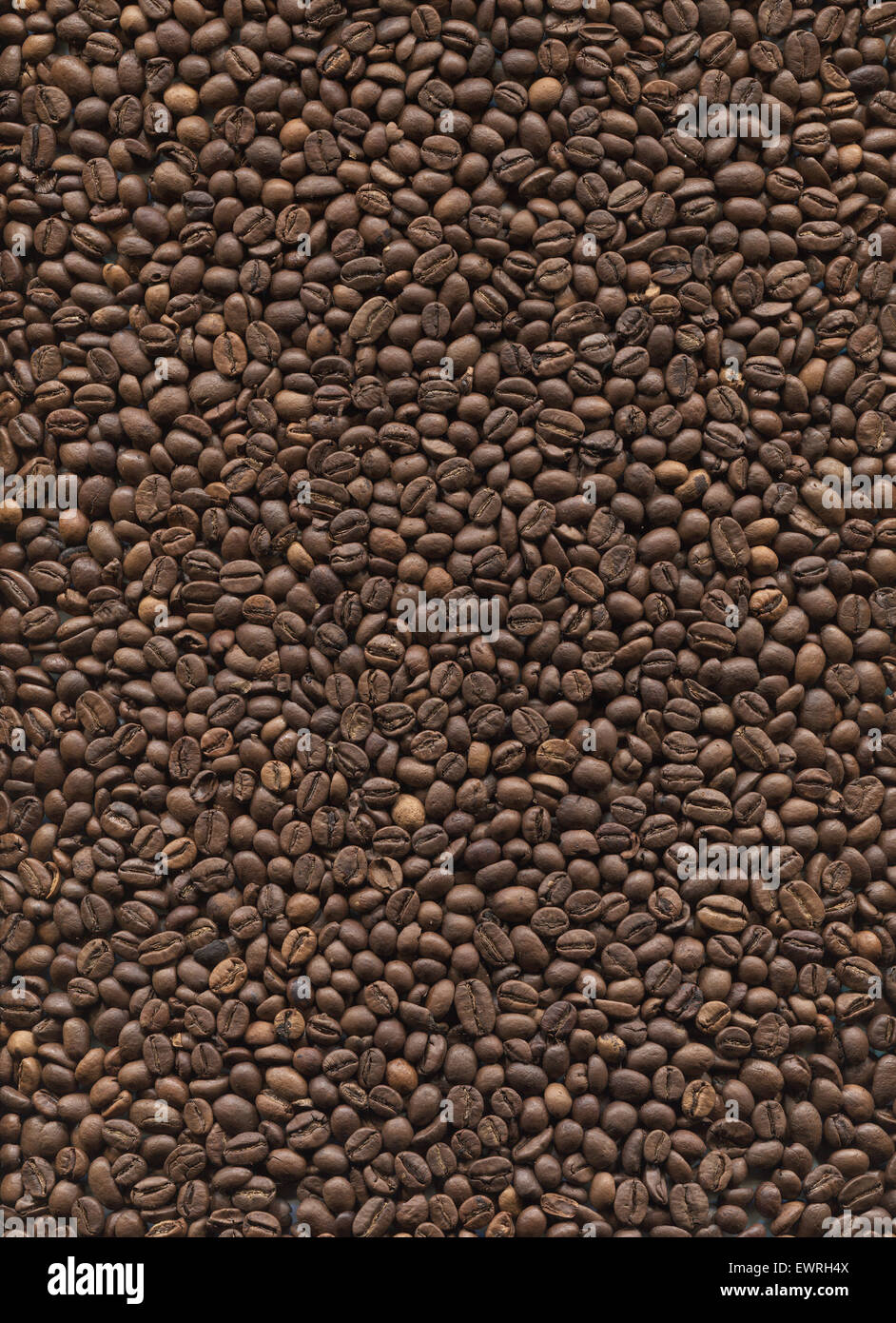 roasted coffee beans close up background Stock Photo - Alamy