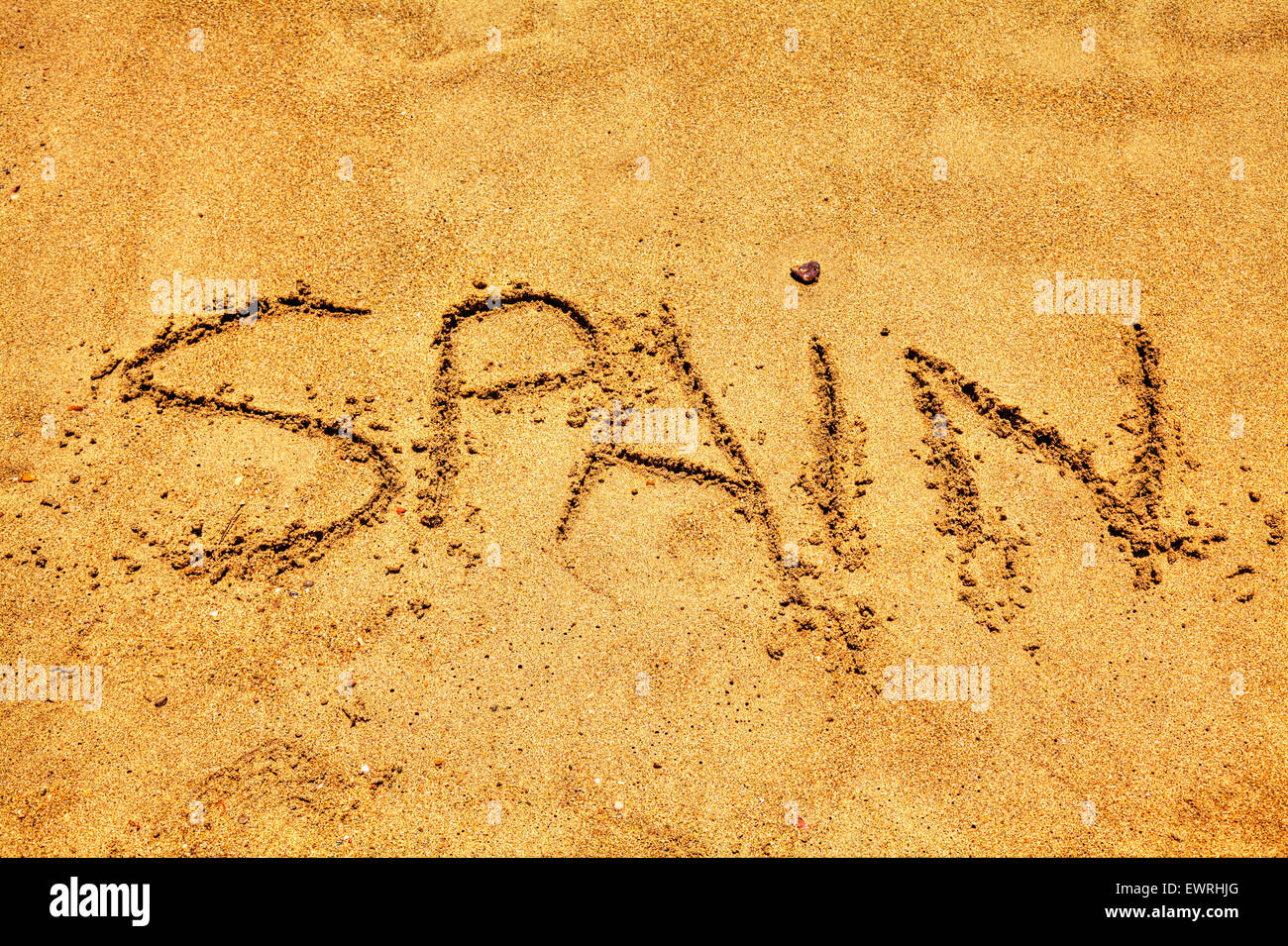 Spain word in sand written on beach Spanish fun resort coast coastlines