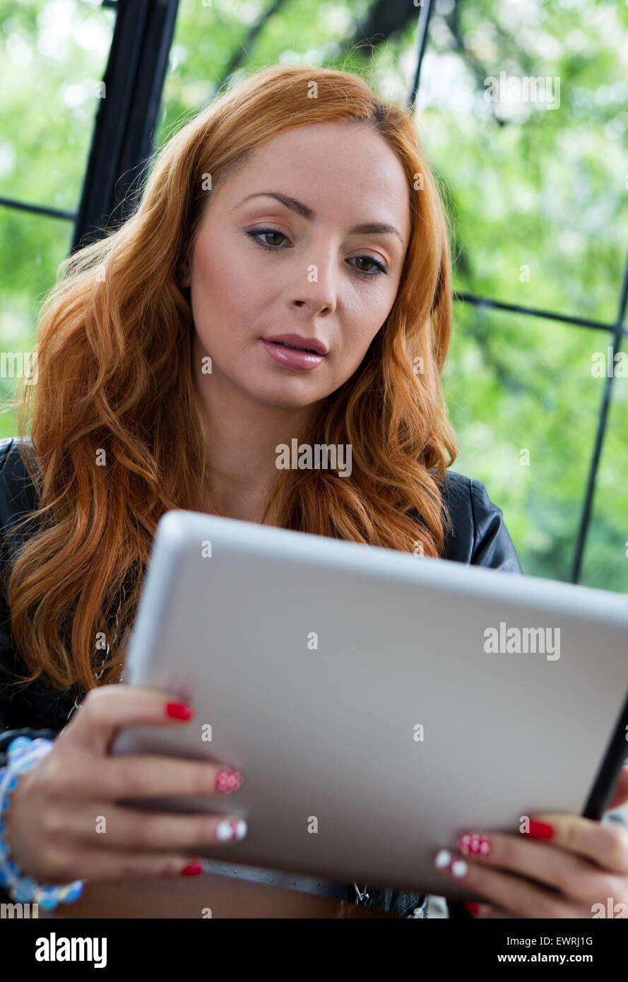 Teen girl reading tablet hi-res stock photography and images - Alamy
