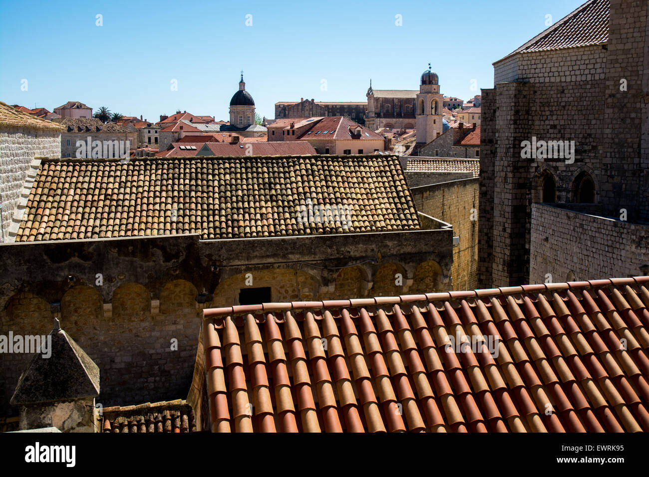 rooftop view of old city from wall with cathedral-treasury tower and clock tower, dubrovnik, croatia Stock Photo