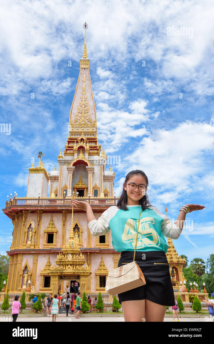 Asian women tourists in Temple. Beautiful pagoda at Wat Chalong or Wat Chaitararam famous attractions and place of worship in Ph Stock Photo
