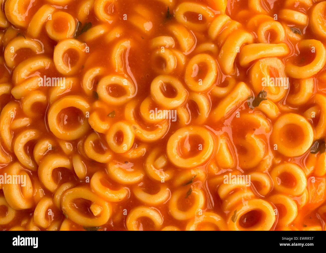 A very close view of canned round spaghetti pasta in tomato sauce