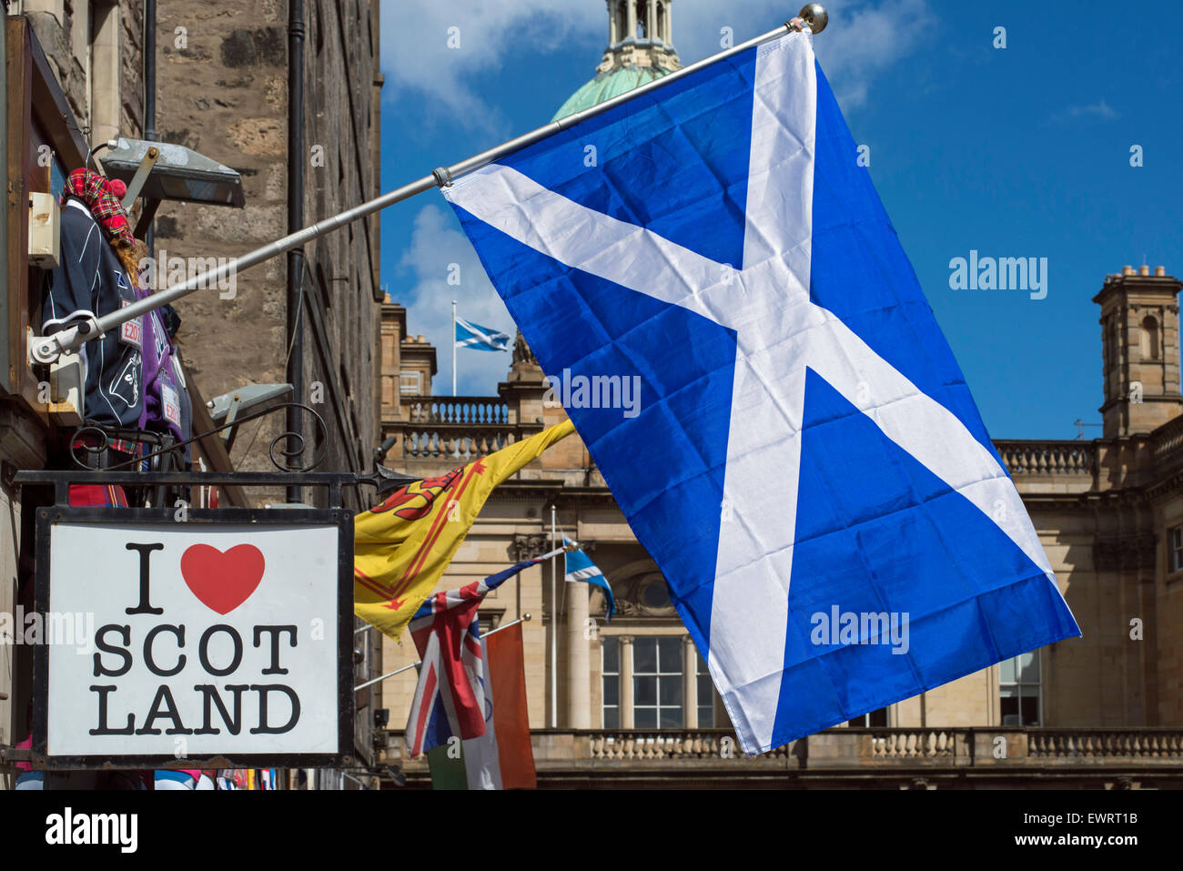 The Scottish Saltire flying outside a tourist souvenir shop in Edinburgh's Old Town. Stock Photo