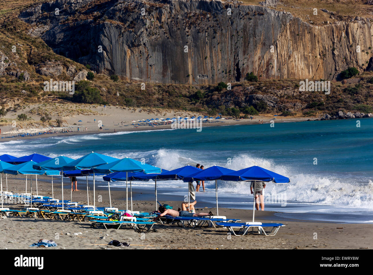 Blue umbrellas on the Beach of Plakias, South Crete beach Greece Europe Stock Photo