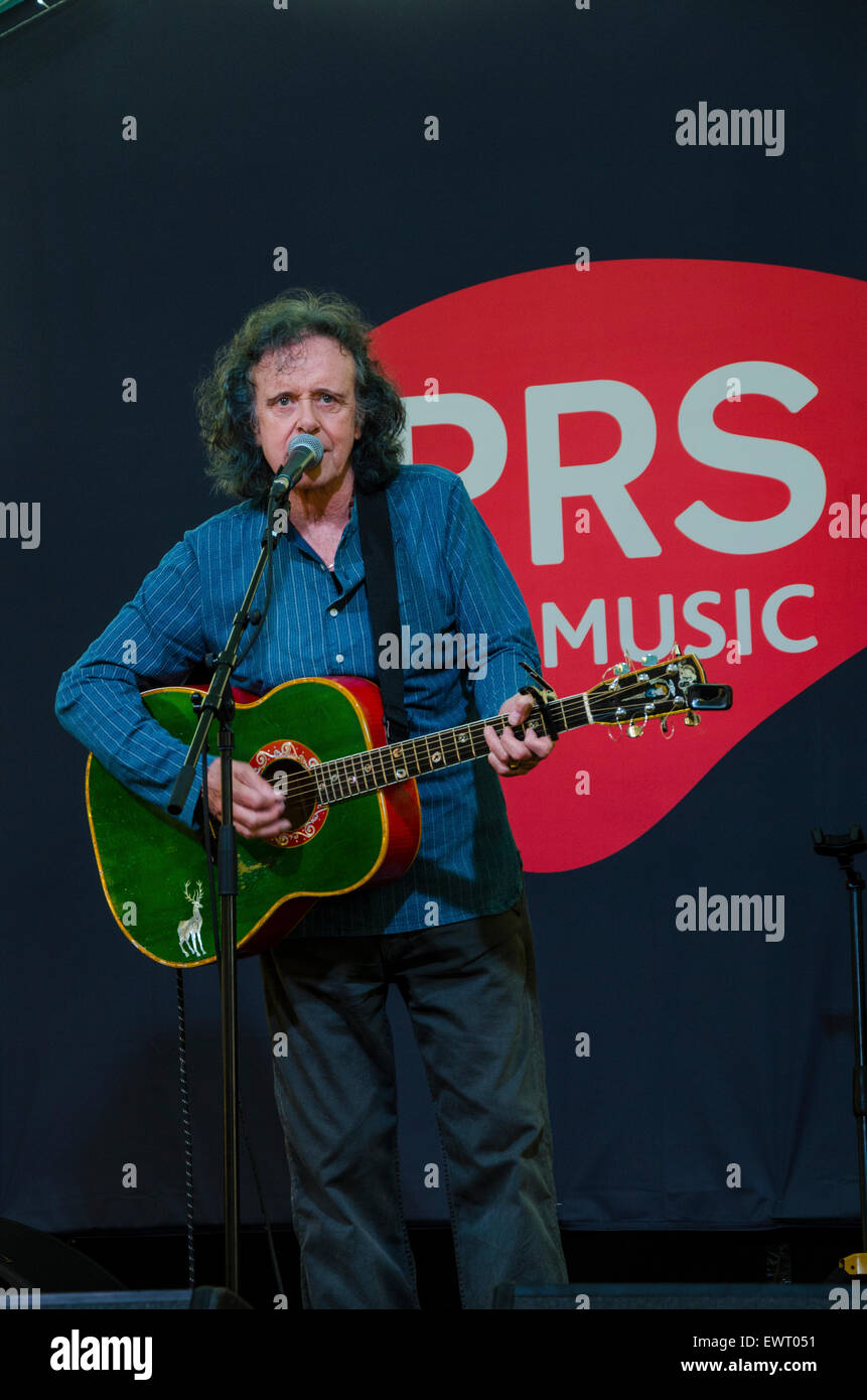 Scottish Singer and Guitarist Donovan playing the PRS For Music stage backstage at Glastonbury Festival 2015 Stock Photo