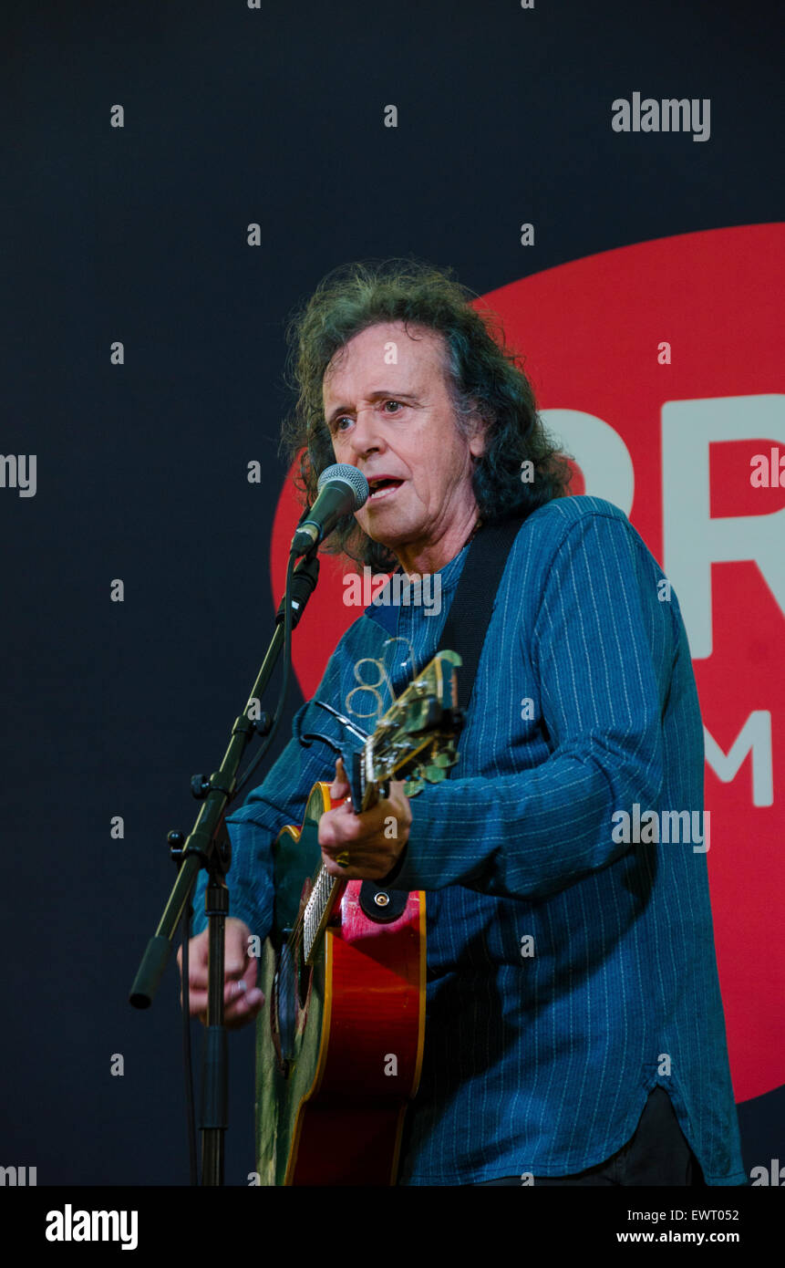 Scottish Singer and Guitarist Donovan playing the PRS For Music stage backstage at Glastonbury Festival 2015 Stock Photo