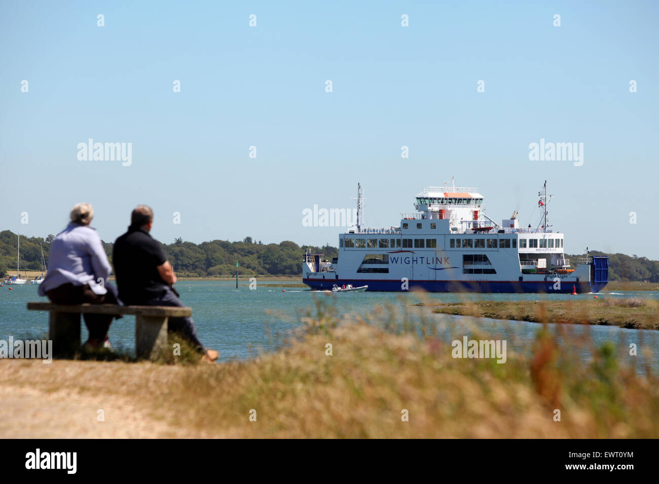 Watching the Wight Link Lymington to Yarmouth Ferry from The Solent Way in Hampshire Stock Photo