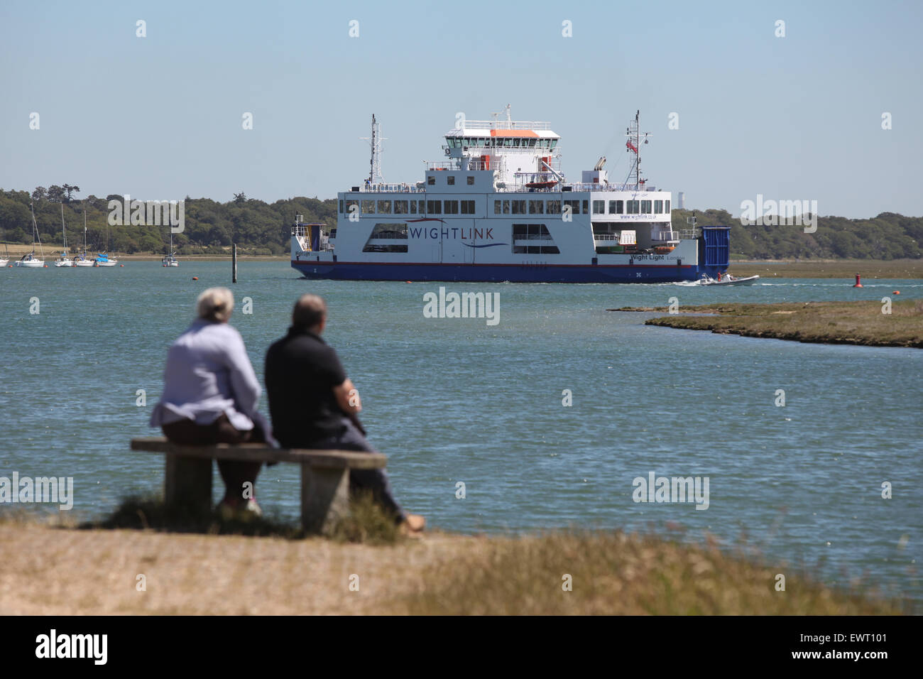 Watching the Wight Link Lymington to Yarmouth Ferry from The Solent Way in Hampshire Stock Photo