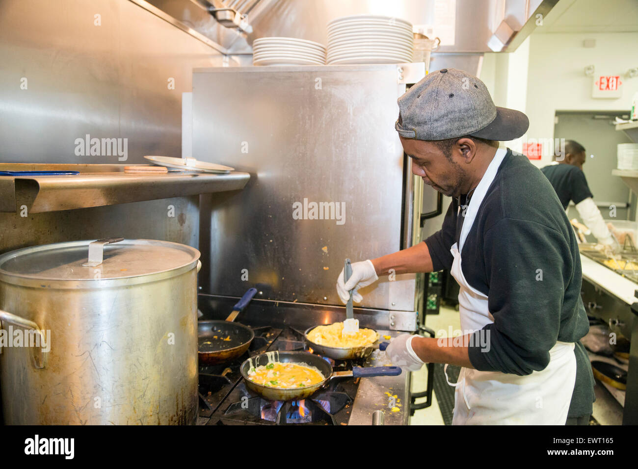 Detroit, Michigan - Kitchen workers at Kuzzo's Chicken & Waffles. Stock Photo