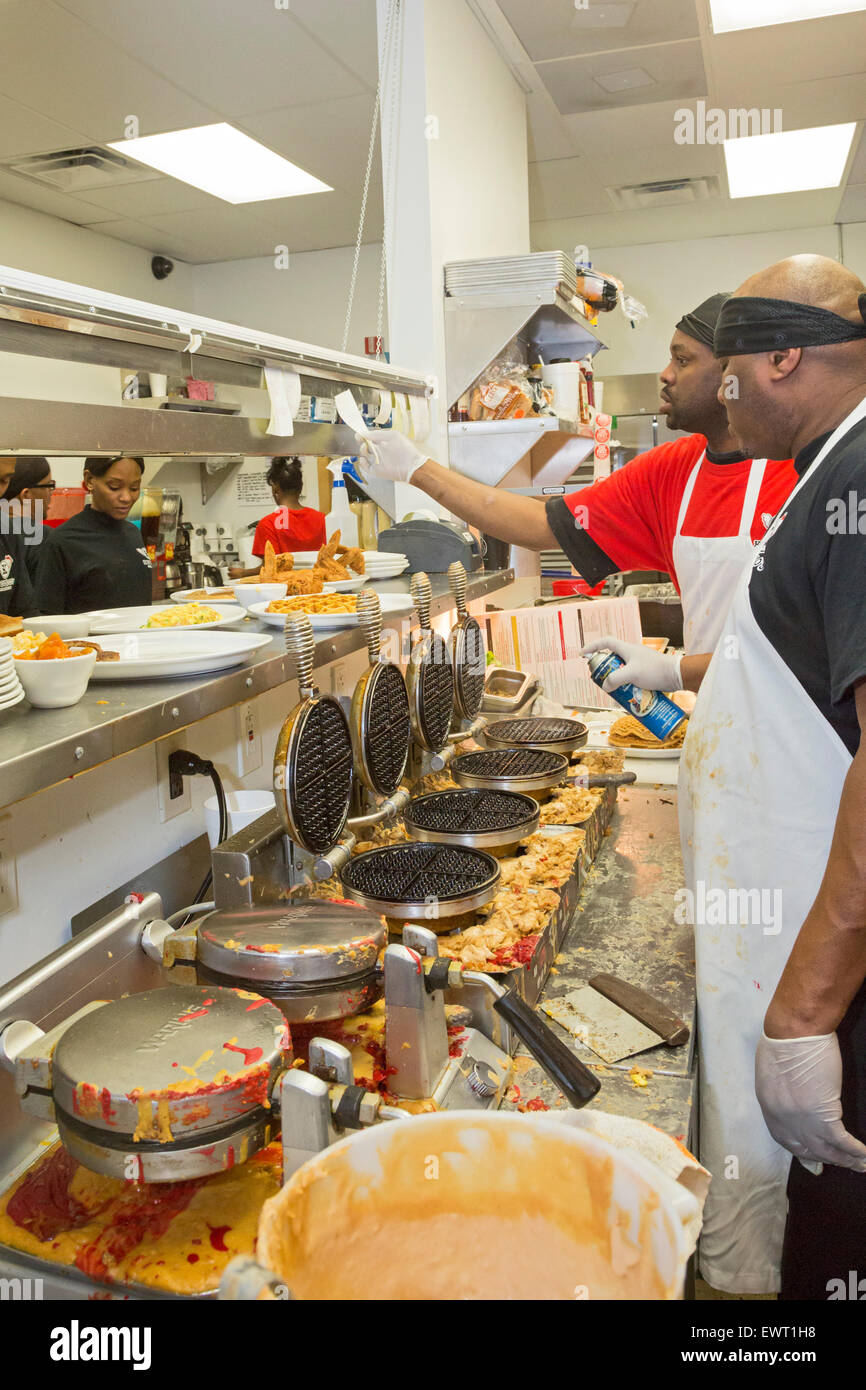 Detroit, Michigan - Kitchen workers at Kuzzo's Chicken & Waffles. Stock Photo