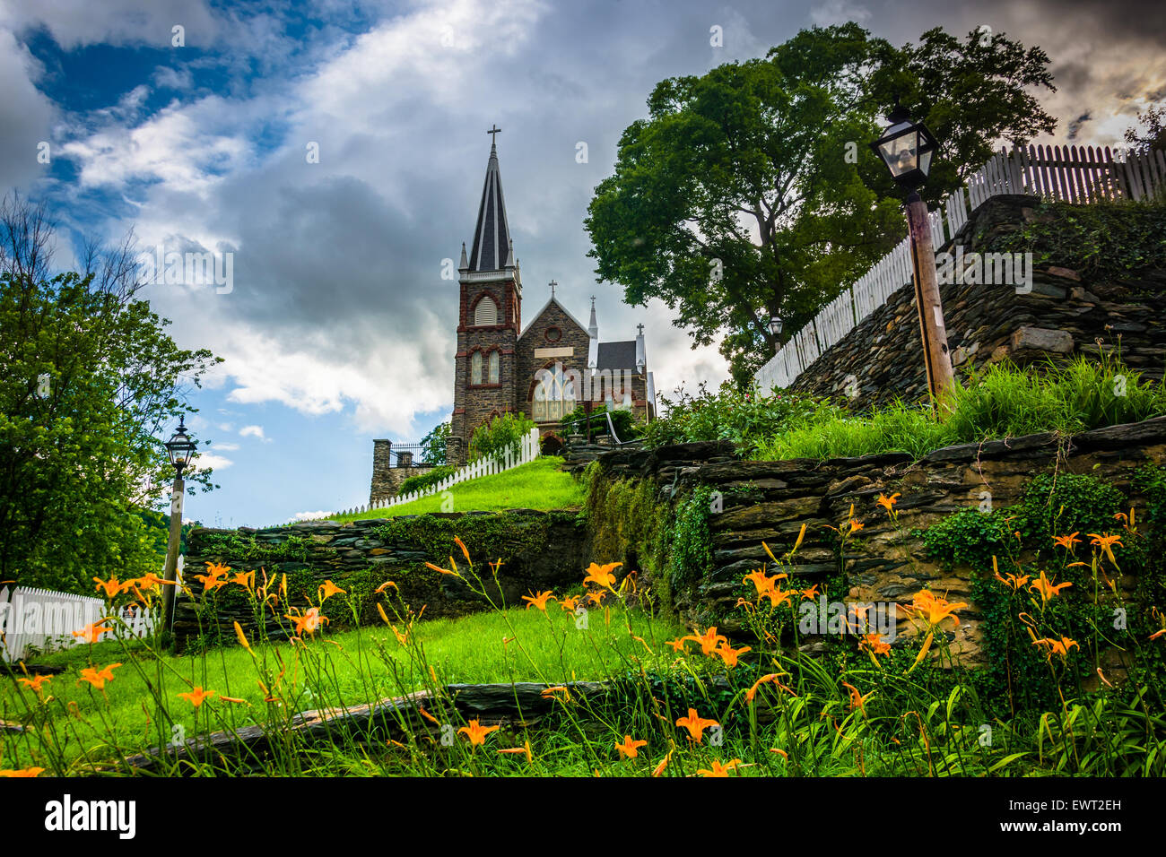 Orange lillies and St. Peters Roman Catholic Church, in Harpers Ferry, West Virginia. Stock Photo