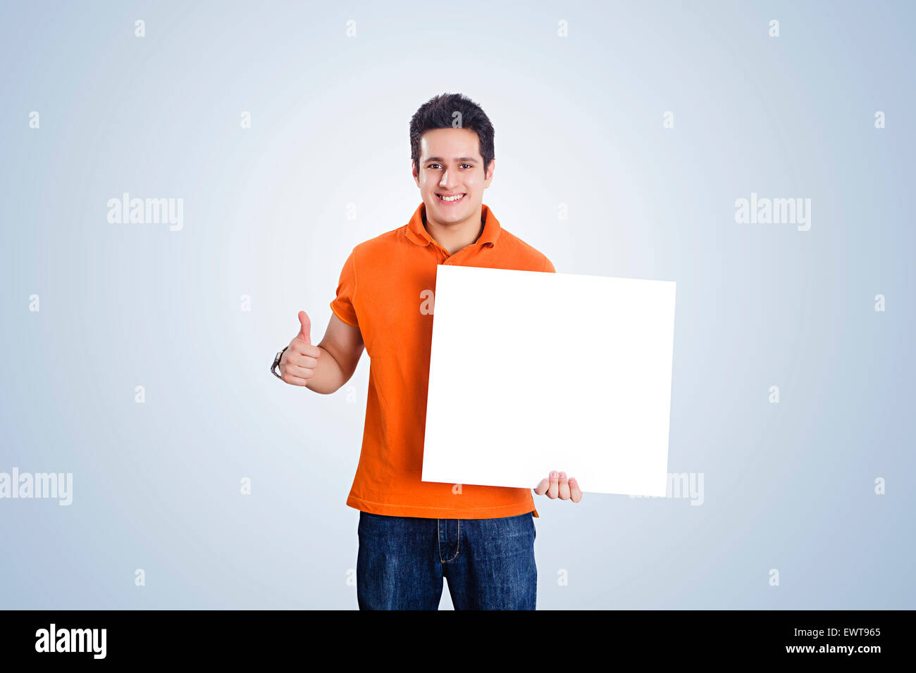 1 indian man thumbs up and showing Message Board Stock Photo Alamy