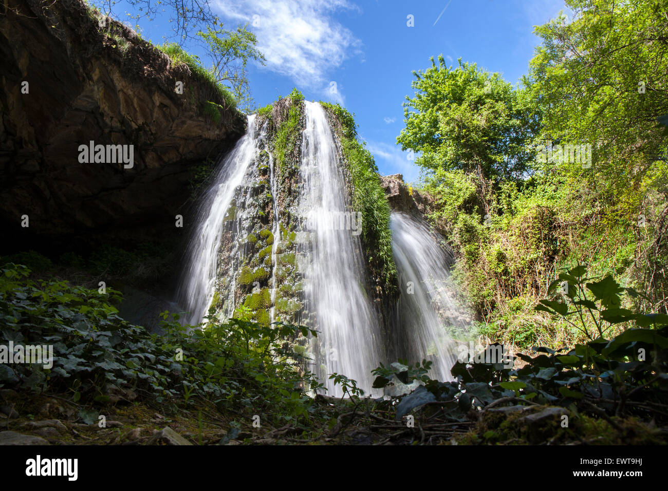 Active Waterfall Natural landscape with a waterfall with much and quick water during an ...