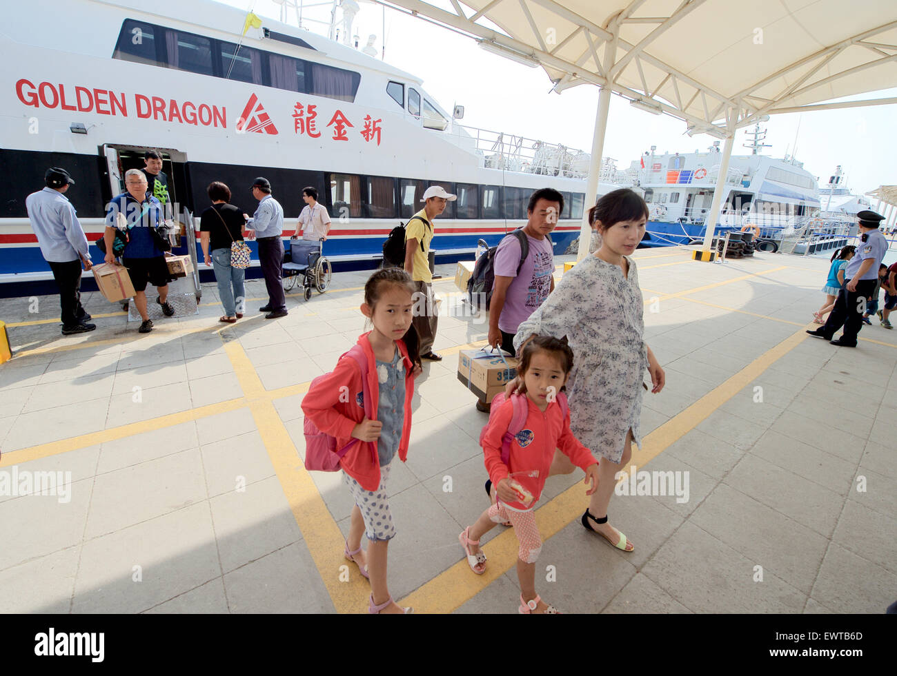 Xiamen, China's Fujian Province. 1st July, 2015. Passengers arrive at the Wutong dock in Xiamen, southeast China's Fujian Province, July 1, 2015. Taiwan residents have been permitted to enter the Chinese mainland only with MTP and no longer have to apply for endorsement as of July 1, according to a new regulation on Chinese people's travel between Taiwan and the mainland. © Jiang Kehong/Xinhua/Alamy Live News Stock Photo
