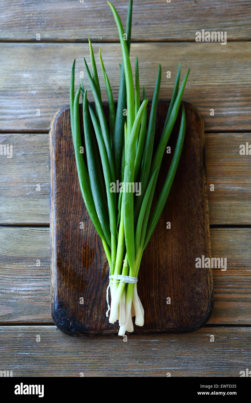 green onion on the chopping board, top view Stock Photo - Alamy