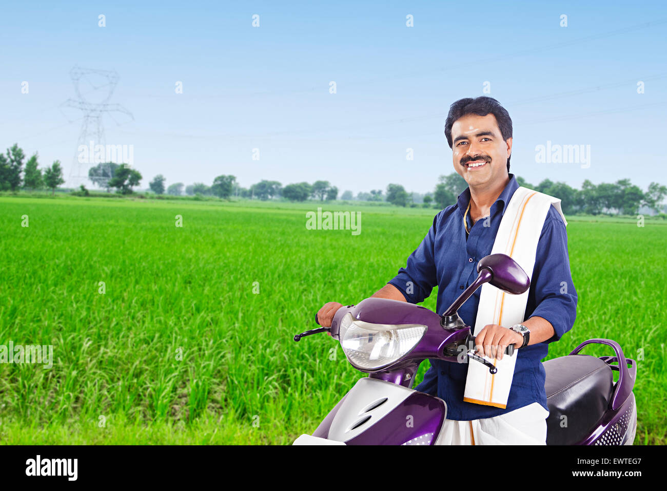 1 South Indian man Farm Riding  Scooty Stock Photo