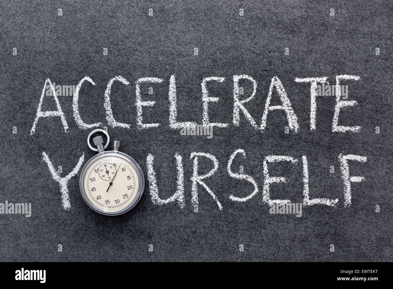 accelerate yourself phrase handwritten on chalkboard with vintage precise stopwatch used instead of O Stock Photo